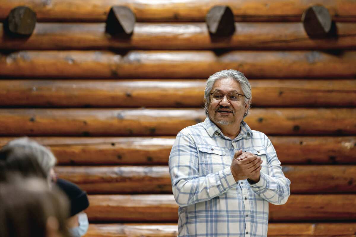 Lac La Croix First Nation speaker Gordon Jourdain, whose Ojibwe name is Maajiigwaneyaash, engages in an annual traditional Ojibwe storytelling gathering at the Log Community Building, Thursday Feb. 24, 2022, in Grand Portage, Minn. Oral storytelling plays a crucial role in Ojibwe spiritual tradition, as is the case with other Native American peoples. Believed to be in itself a gift from the Creator, the recounting of tribal lore helps keep cultural worldviews, ethical teachings and religious experiences alive across generations. (AP Photo/Stacy Bengs)