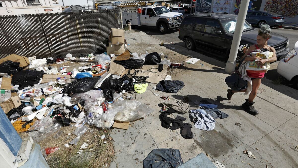 A pile of trash sits uncollected on Santee St. in between 18th St. and Washington Blvd in the fashion district of Los Angeles. An outbreak of typhus has been linked to overcrowding and homelessness in downtown Los Angeles.