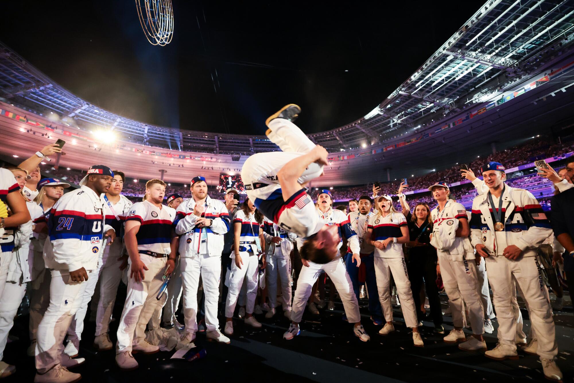 Team USA celebrates in the pit at Stade de France.