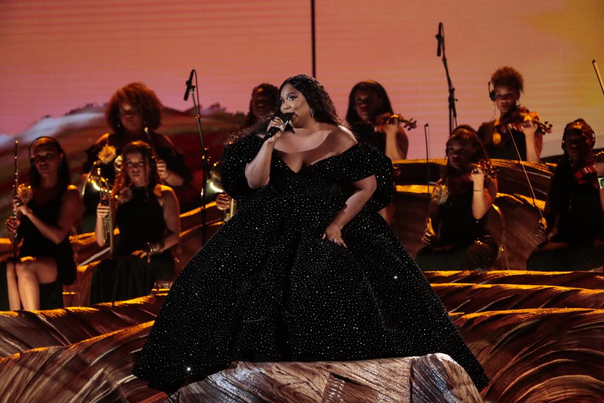 Lizzo performs at the 62nd Grammy Awards