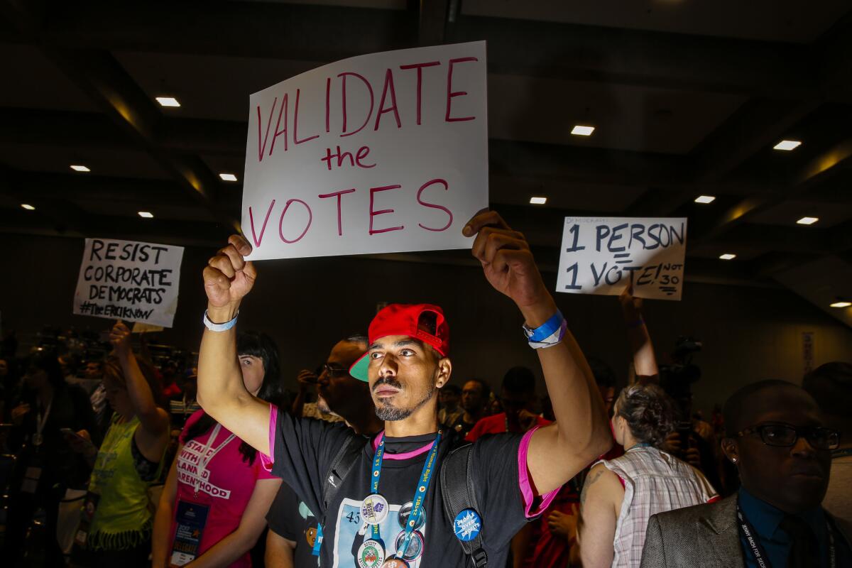 Gilbert Feliciano shows support for a parliamentary move during a contentious moment at the California Democratic Party state convention in 2017.
