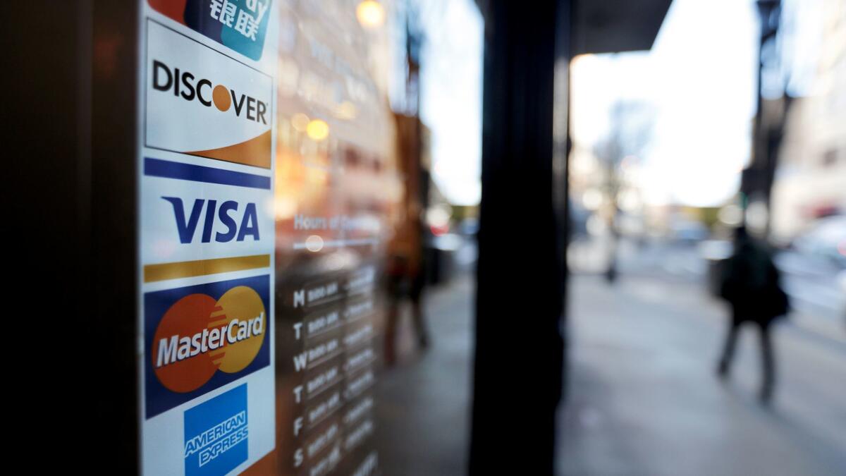 Consumers are borrowing at a record pace, and much of it's going on the card.