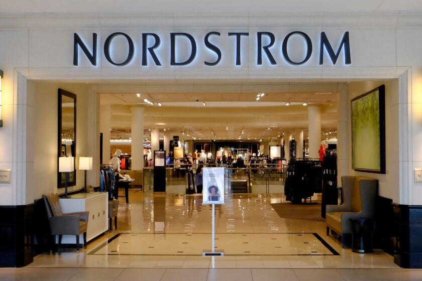 Shoppers enter a Nordstrom store, Wednesday, Aug. 23, 2017, in Indianapolis. (AP Photo/Darron Cummings)