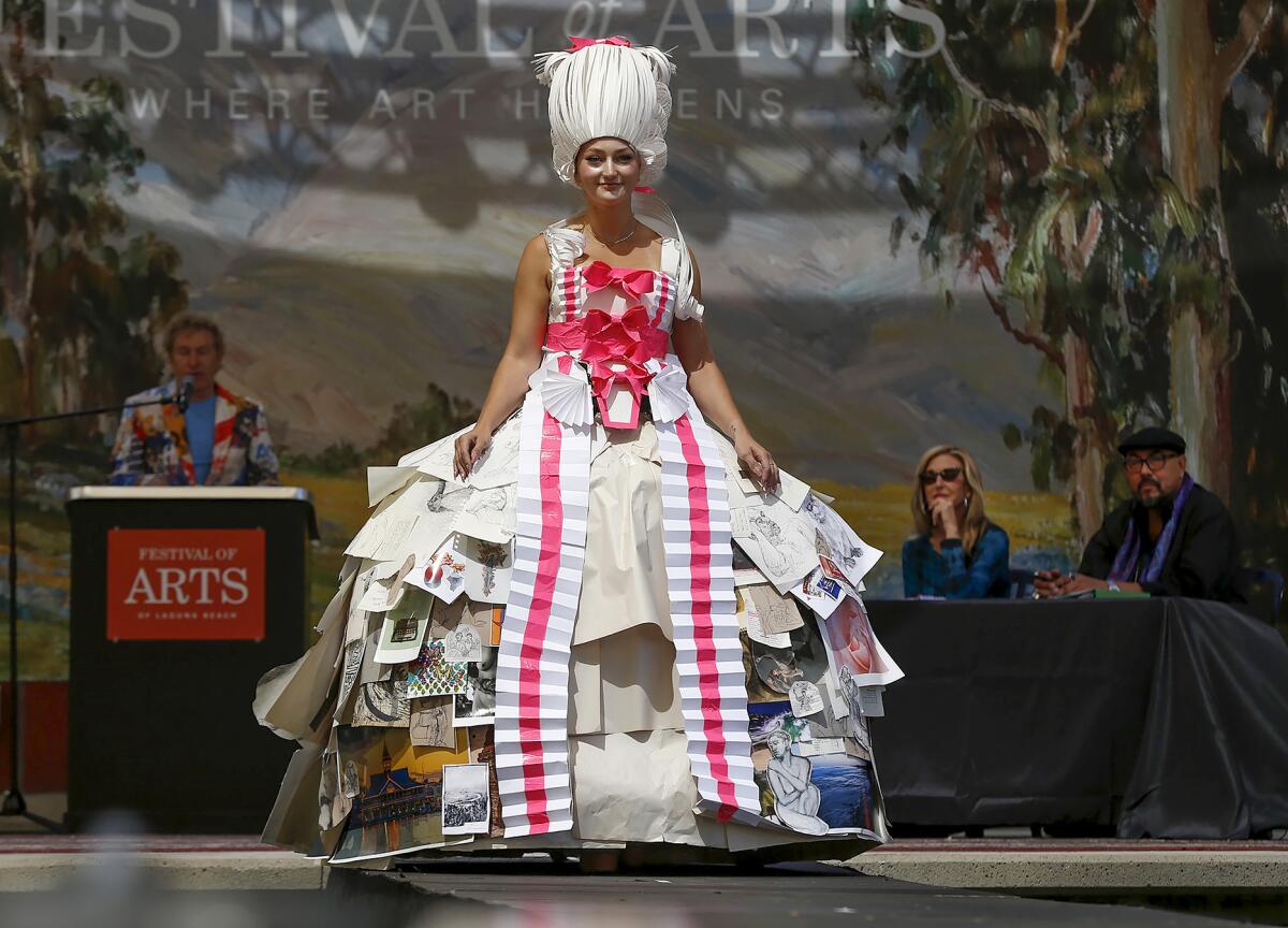 Model Kayla Johnson wears a dress Sunday created by artist Rowan Foley in a Festival Runway Fashion Show at Festival of Arts.