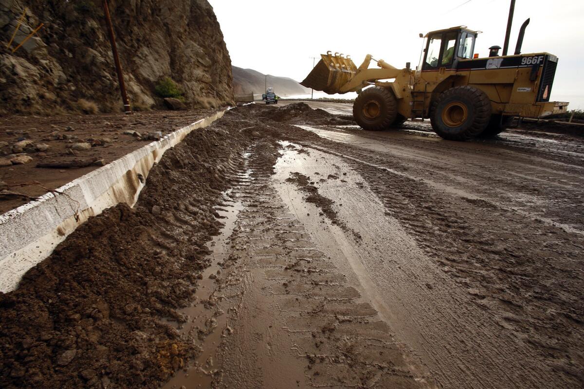 Work crews remove mud and debris that closed Pacific Coast Highway between Las Posas and Yerba Buena roads in Ventura County in late November.