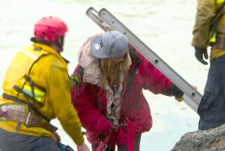 A woman was rescued from a storm drain in the Santa Ana River in Anaheim on Feb. 6, 2024. (KTLA)