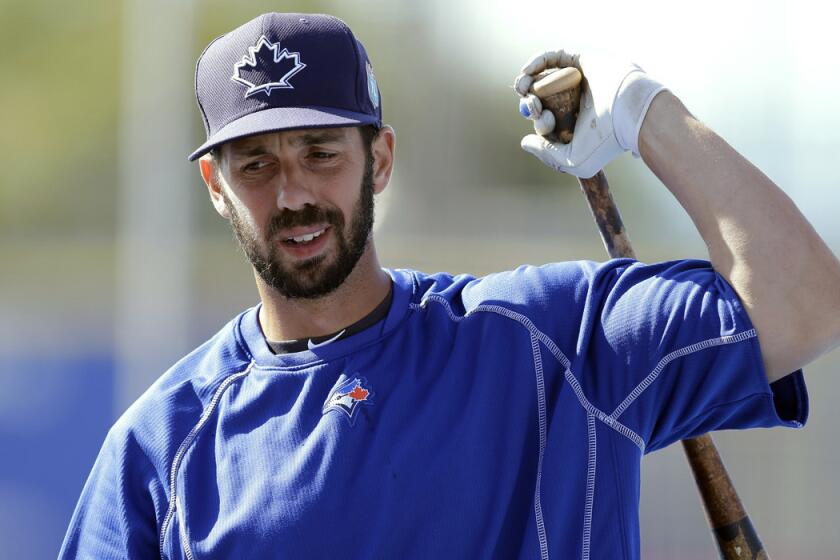 Toronto Blue Jays' Chris Colabello loosens up before a spring training baseball game against the New York Mets in Dunedin, Fla. on March 23.