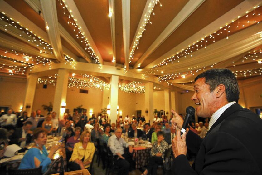 John Duran, a candidate for the Los Angeles County Board of Supervisors, speaks to members of the Valley Alliance of Neighborhood Councils during a campaign stop at the CBS Commissary known as Carla's Cafe in Studio City.