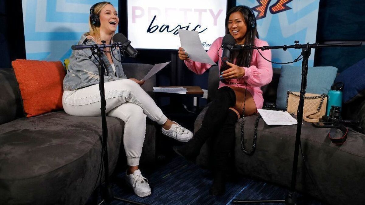 Alisha Marie and Remi Cruz record their Ramble Network podcast show "Pretty Basic" at Cadence13 in Los Angeles. Podcast app use is up, particularly among millennials, a new report shows.
