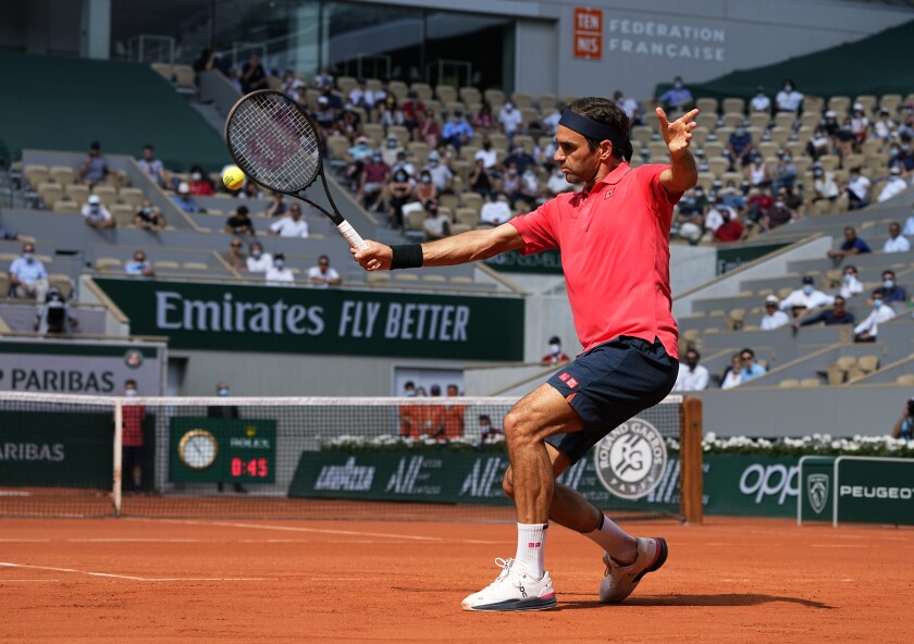 Roger Federer plays a return during his second-round victory over Marin Cilic at the French Open on Thursday.