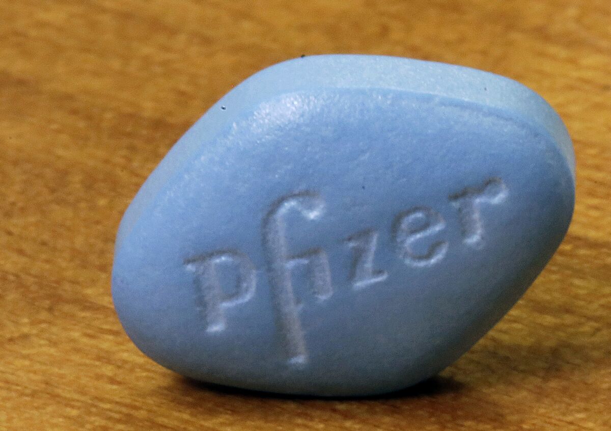 FILE - In this Monday, Dec. 4, 2017, photo, Pfizer's Viagra, is photographed at Pfizer Inc. headquarters in New York. On Friday, Jan. 14, 2022, The Associated Press reported on stories circulating online incorrectly claiming Viagra can cure COVID-19. (AP Photo/Richard Drew)