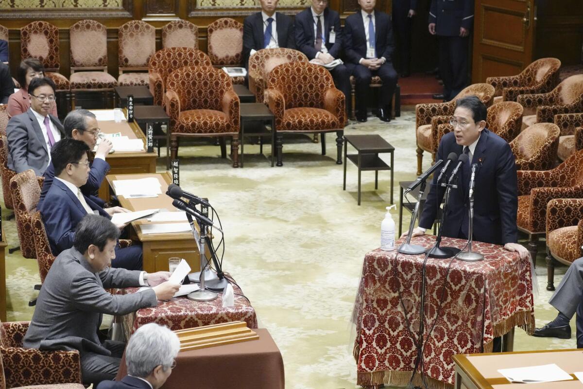 Japan PM purges Cabinet after support falls over church ties