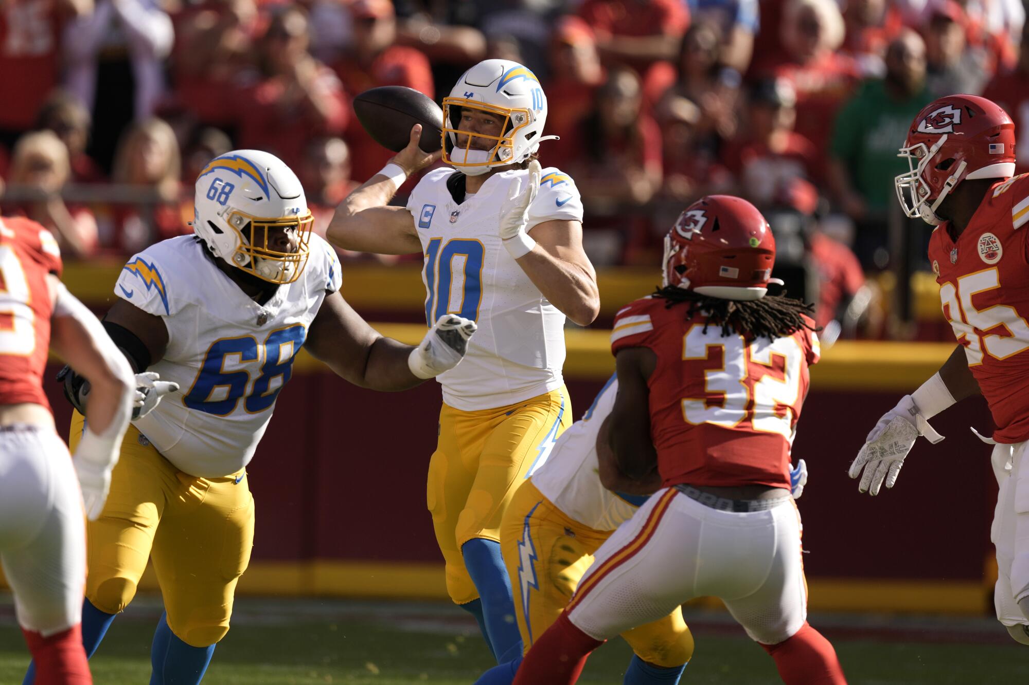 Chargers quarterback Justin Herbert throws during the first quarter against the Kansas City Chiefs at Arrowhead Stadium.