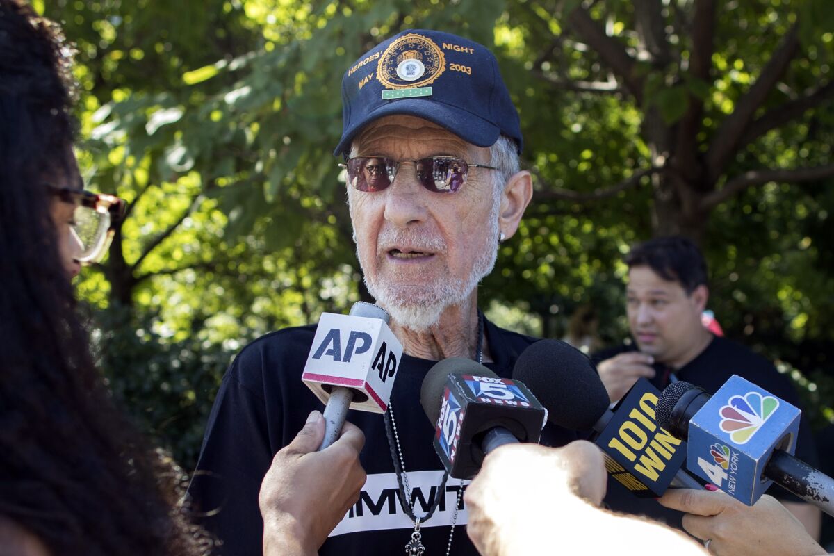 FILE —Retired New York City Police Officer Frank Serpico speaks to reporters after a rally to show support for Colin Kaepernick, Aug. 19, 2017, in New York. More than 50 years after he testified about endemic corruption in the NYPD, the department finally recognized his service and injury in the line of duty with an official certificate and inscribed medal of honor. The former undercover detective, now 85, received the honor in the mail on Thursday, Feb. 3, 2022., the New York Daily News reported. (AP Photo/Mary Altaffer, File)