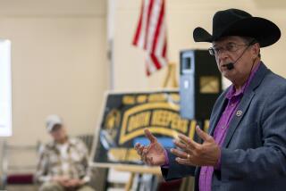 In this photo provided by the Arizona Center for Investigative Reporting, Constitutional Sheriffs and Peace Officers Association founder Richard Mack speaks to a crowd of about 100 people at a Yavapai County Preparedness Team meeting in Chino Valley, Ariz., Oct. 8, 2022. Mack regularly speaks at events and trainings for the public, law enforcement and county officials. (Isaac Stone Simonelli/Arizona Center for Investigative Reporting via AP)
