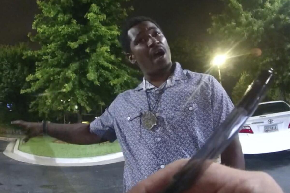 An image taken from a body camera video shows Rayshard Brooks speaking with an Atlanta police officer.