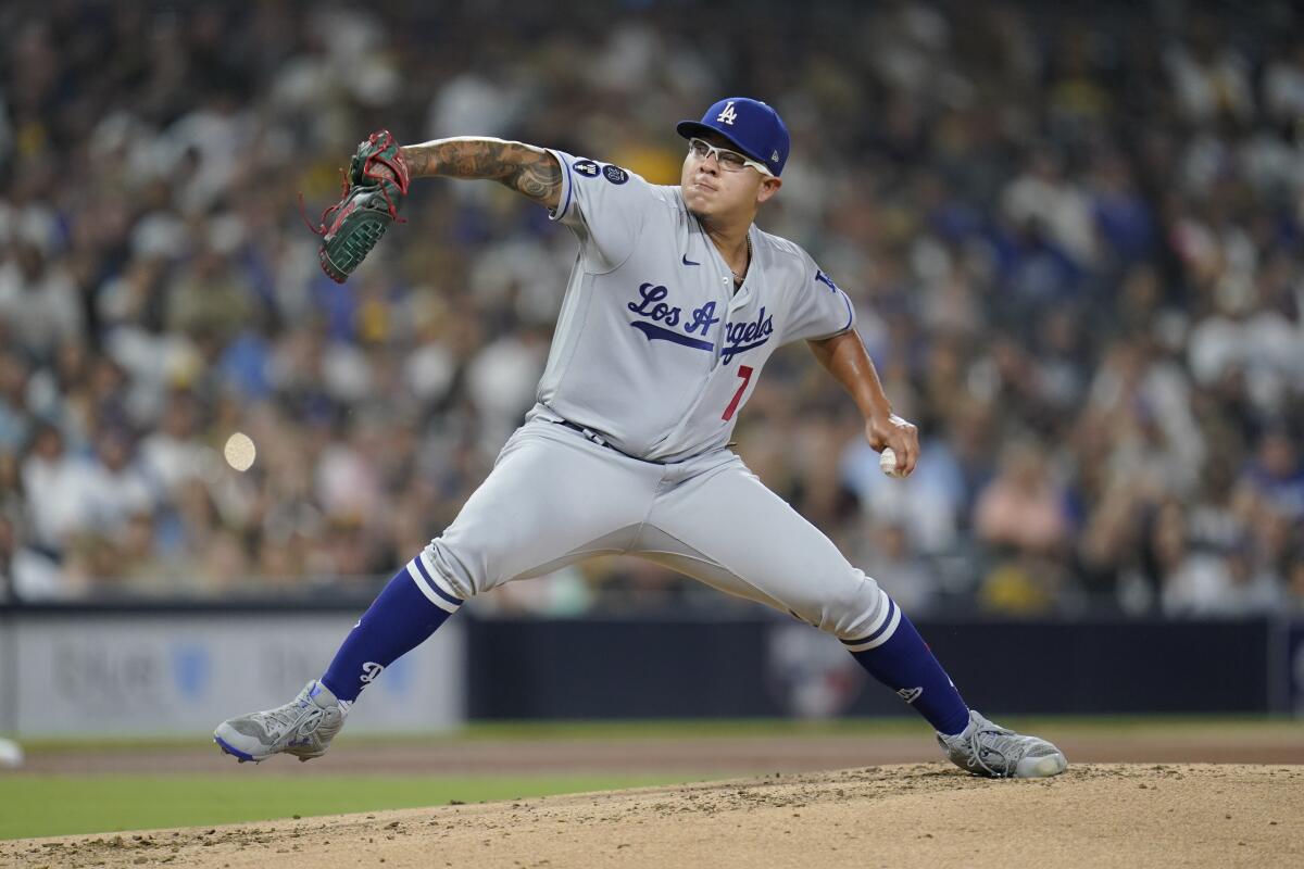 Dodgers pitcher Julio Urías pitches to a San Diego Padres batter.