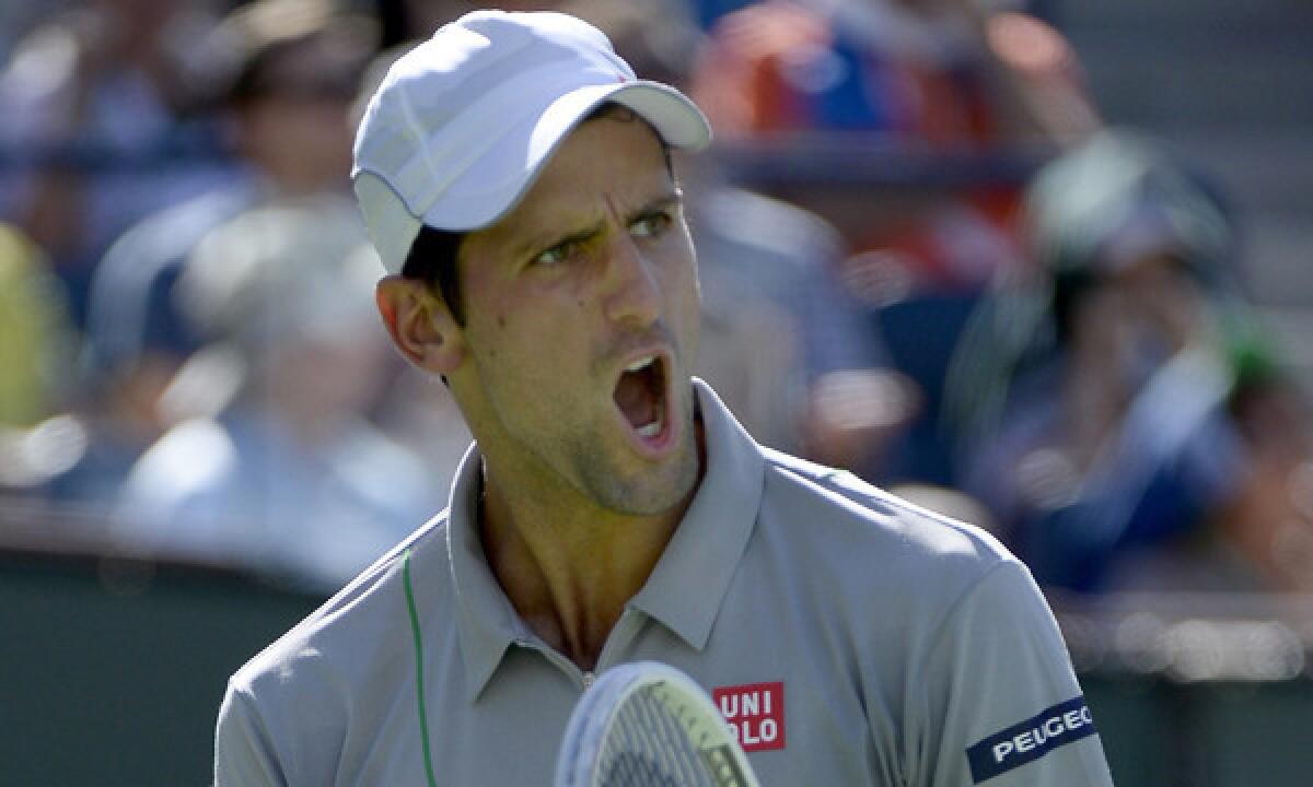 Novak Djokovic celebrates during his victory over Roger Federer in the BNP Paribas Open final at Indian Wells on Sunday.