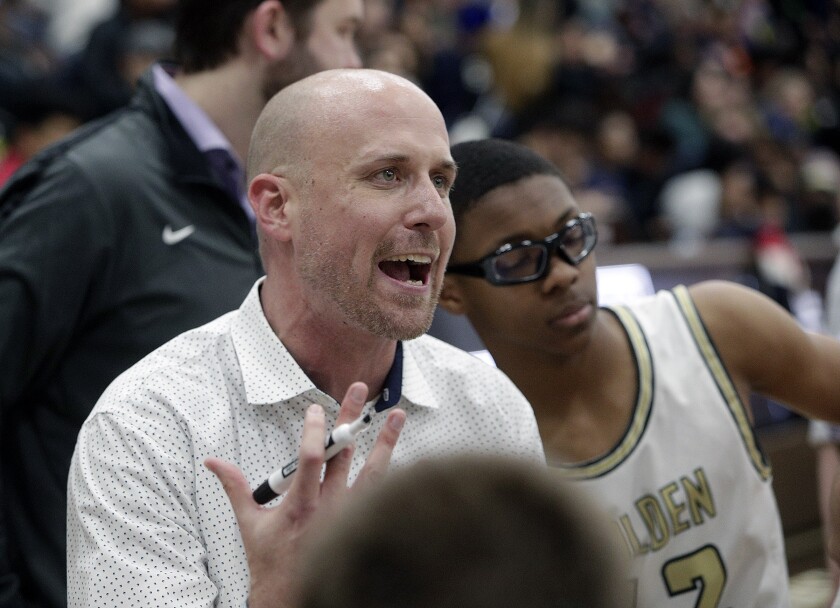 Todd Wolfson talks to his players during a regional championship game victory in 2016.