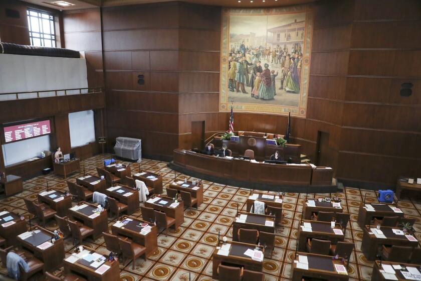 The Senate chambers sits nearly empty at the Oregon State Capitol in Salem, Ore., Thursday, May 4, 2023. Republican members of the Oregon Senate on Thursday extended their boycott of Senate proceedings into a second day, delaying action by the majority Democrats on bills on gun safety, abortion rights and gender-affirming health care. (AP Photo/Amanda Loman)