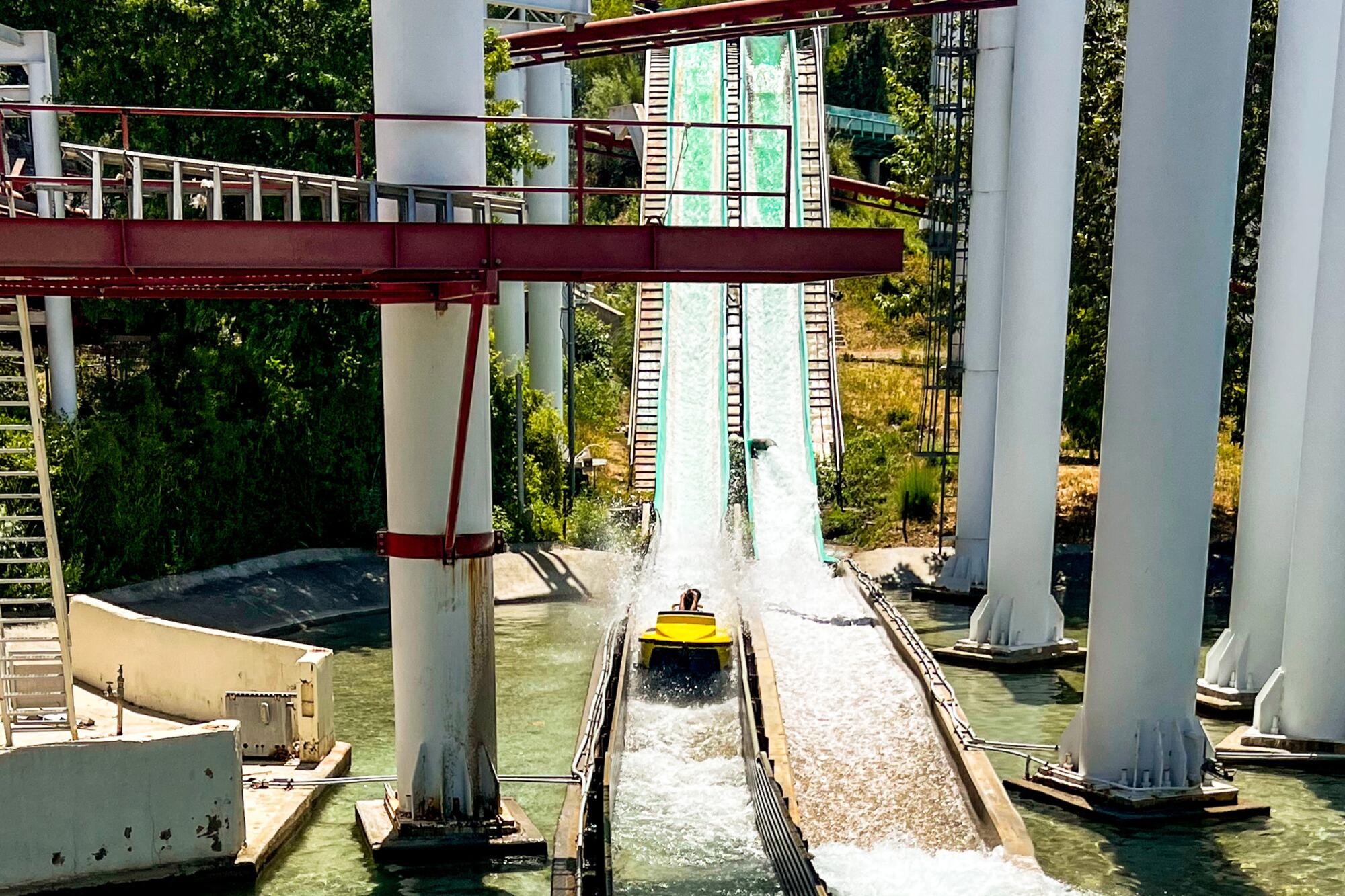 A roller coaster's track runs through water