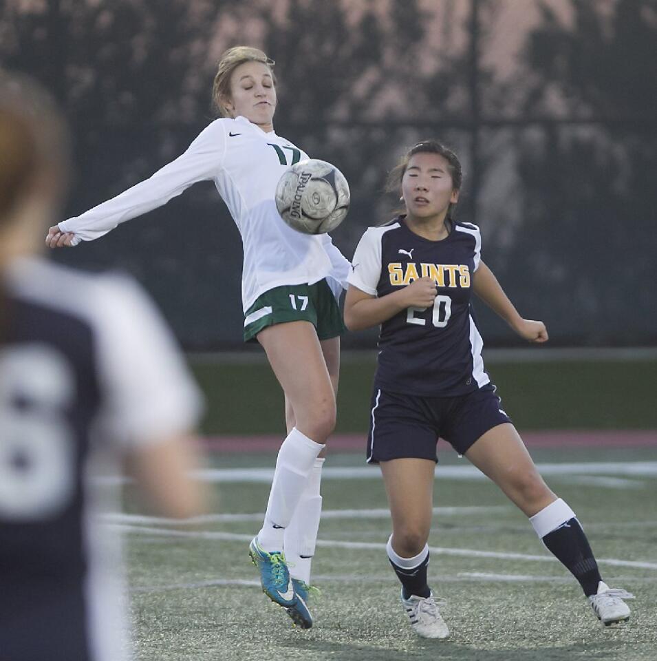 Sage Hill's Lexi Magliarditi (17) controls the ball as Crean Lutheran's Grace Song battles for the ball.