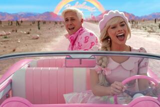 (l-r) Ryan Gosling as Ken and Margot Robbie as Barbie in 'Barbie.'