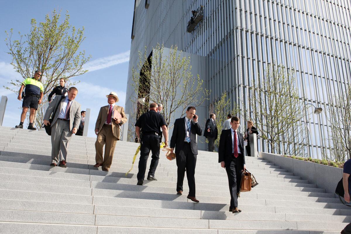 Salt Lake City federal courthouse employees evacuate as police investigate a shooting inside the court building.