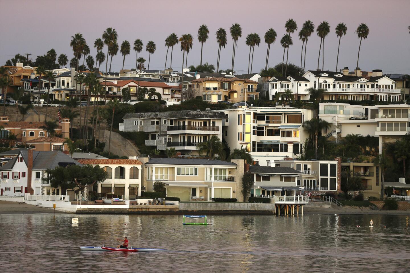 A kayaker cruises cruises through Newport Harbor on election day in Newport Beach.