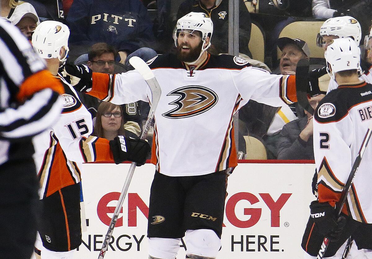 Ducks forward Patrick Maroon, center, celebrates a goal with teammates during the second period of a game against the Penguins.