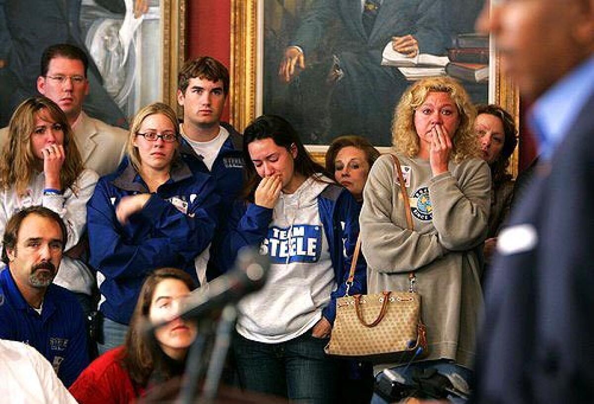 GOP DEFEAT: Annapolis campaign workers for Michael Steele listen to him concede his loss in Marylands U.S. Senate race against Democrat Benjamin L. Cardin.