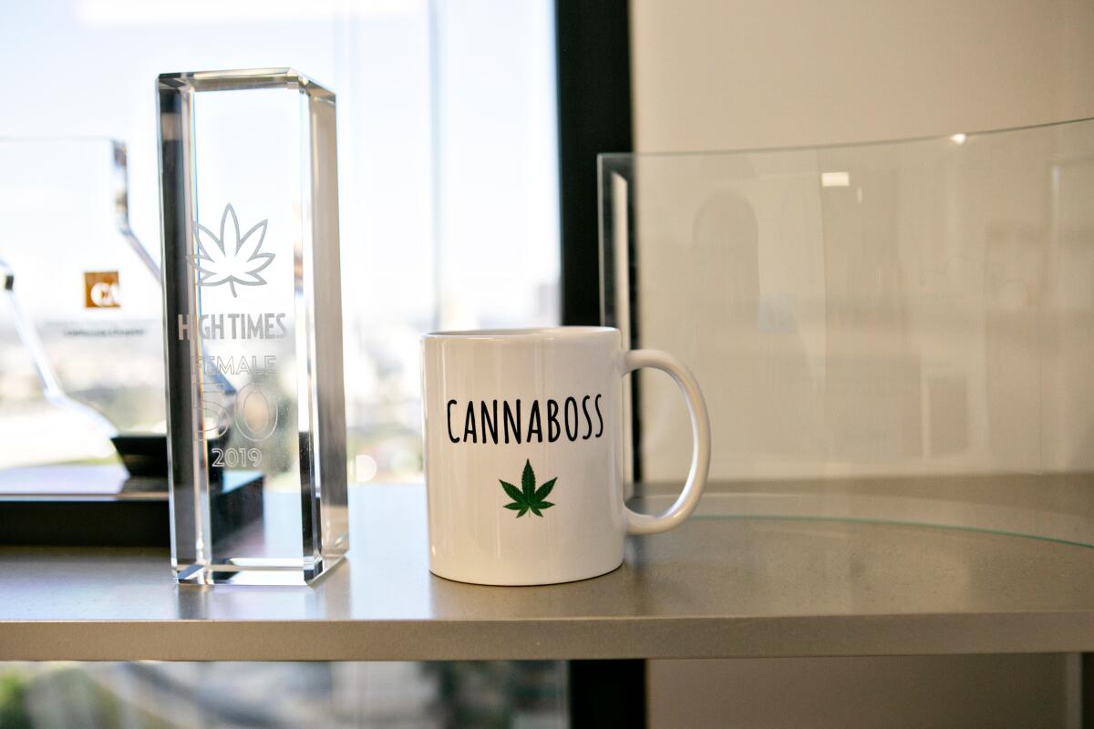 A "canniboss" coffee mug in Cat Packer's office