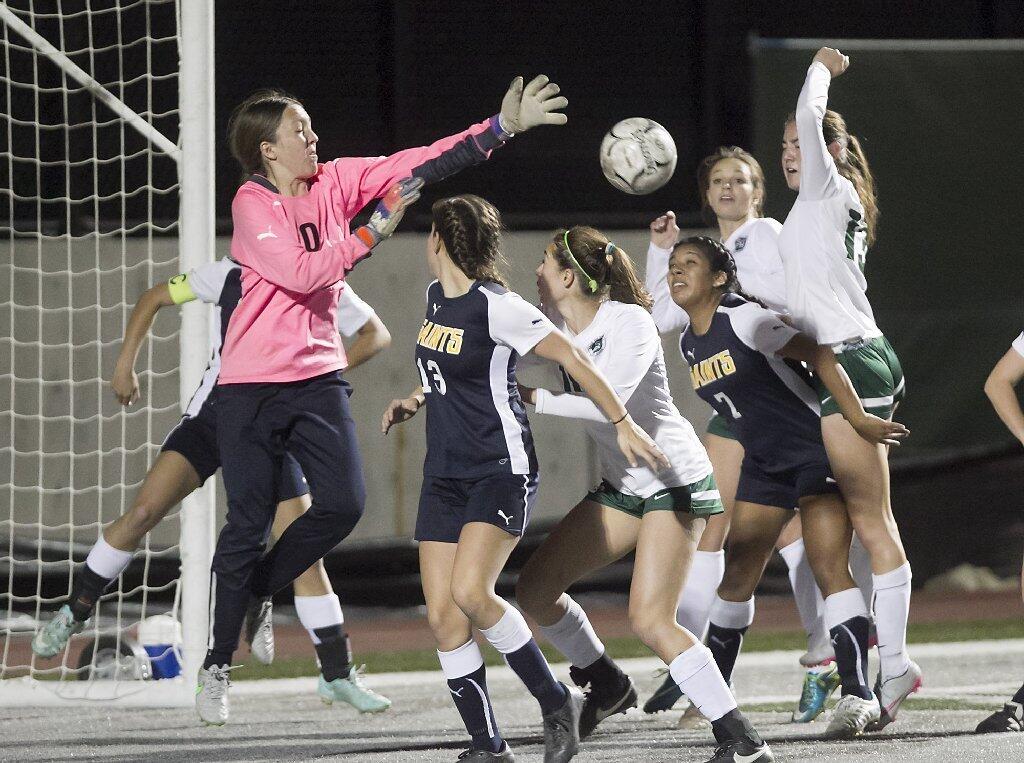 Sage Hill girls rush the net on a throw-in which led to a score against Crean Lutheran on Thursday at Sage Hill.