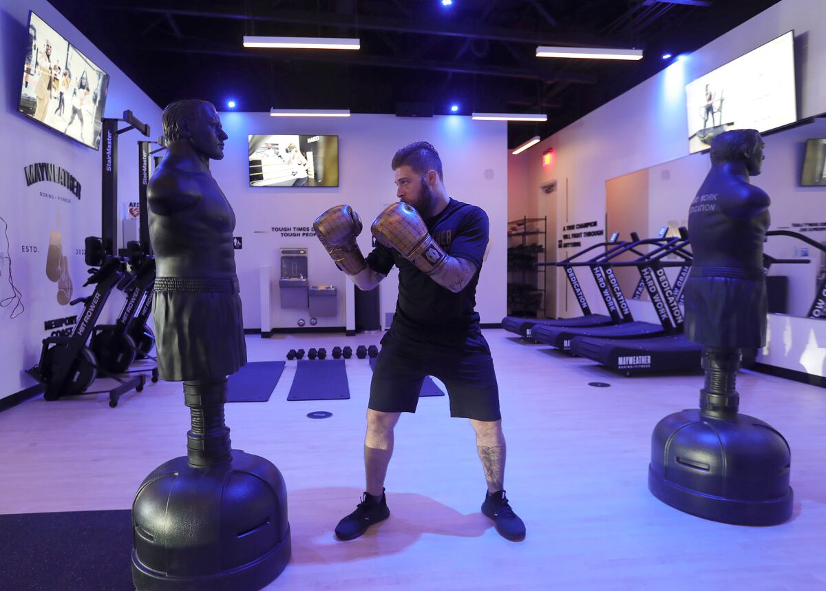 Coach Ian Cohen shows proper form as he prepares for a class at the new Mayweather Boxing + Fitness studio in Newport Coast.