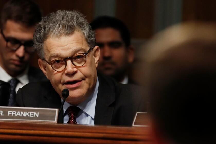 Senate Judiciary Committee member Sen. Al Franken, D-Minn., left, questions Eric Treene, Special Counsel For Religious Discrimination, Civil Rights Division of the Justice Department, right, on Capitol Hill in Washington, Tuesday, May 2, 2017, during the committee's hearing on responses to the increase in religious hate crimes. (AP Photo/Carolyn Kaster)