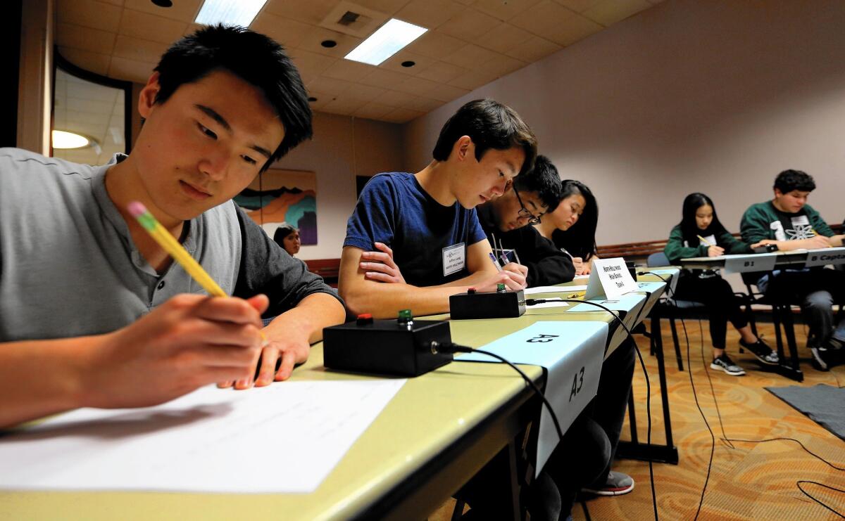 Richard Shuai, a member of the A-team from North Hollywood High School, competes in the L.A. Department of Water and Power Science Bowl on Saturday.