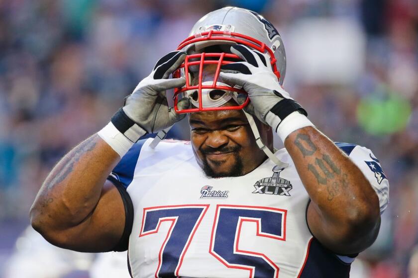New England Patriots defensive tackle Vince Wilfork (75) takes off his helmet before the NFL Super Bowl XLIX football game against the Seattle Seahawks Sunday, Feb. 1, 2015, in Glendale, Ariz. (AP Photo/Mark Humphrey) ORG XMIT: NFL1