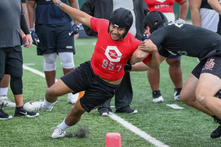 Defensive end Ioholani Raass from Skyridge High in Lehi, Utah gets around JSerra offensive lineman Jeffrey Persi during a one-on-one pass rush drill at the Opening Los Angeles regional on Feb. 10, 2019.