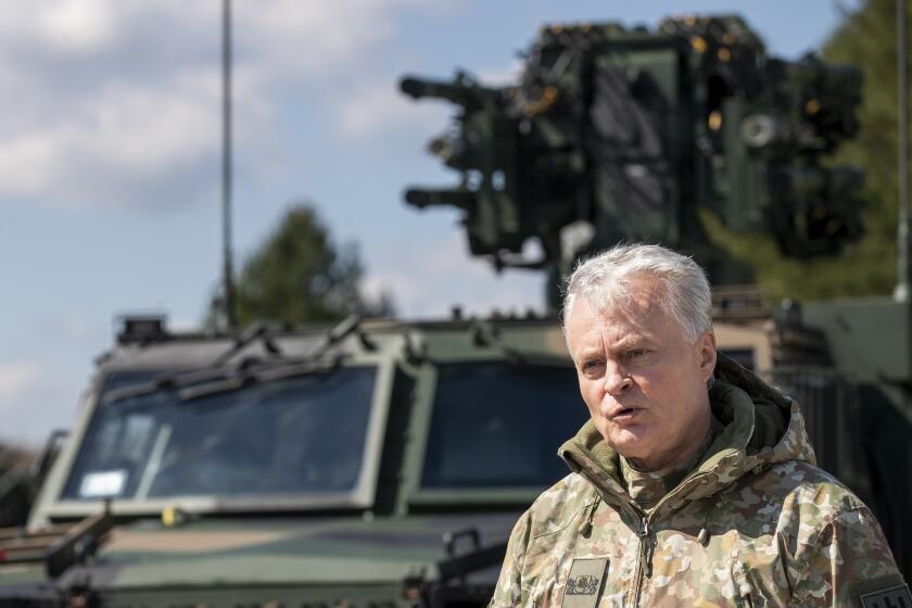 FILE - Lithuania's President Gitanas Nauseda speaks during a joint media conference with Poland's President Andrej Duda during the Lithuanian-Polish Brave Griffin 24/II military exercise near the Suwalki Gap close to the Polish border at the Dirmiskes village, Alytus district west of the capital Vilnius in Lithuania on April 26, 2024. Lithuanians are casting votes in a presidential election on Sunday at a time when Russian gains on the battlefield in Ukraine are fueling greater fears about Moscow’s intentions.(AP Photo/Mindaugas Kulbis, File)