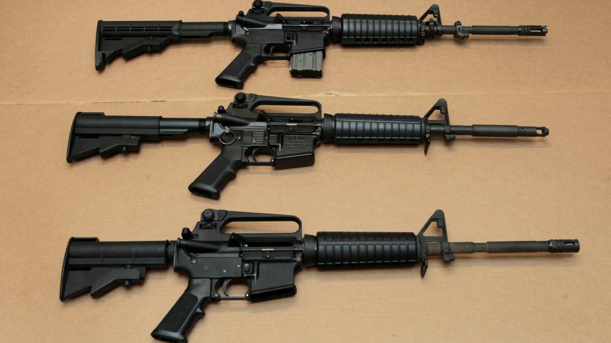 Three variations of the AR-15 assault rifle are displayed at the California Department of Justice in Sacramento, Calif.