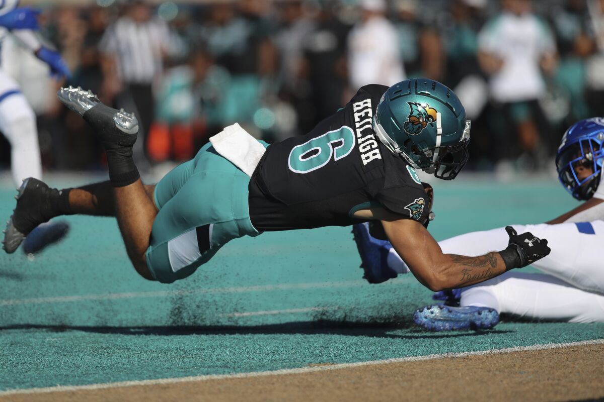 Coastal Carolina wide receiver Jaivon Heiligh (6) is down at the one yard line after a 39 yard catch against Georgia State during the first half of an NCAA college football game Saturday, Nov. 13, 2021, in Conway, S.C. (AP Photo/Artie Walker, Jr.)