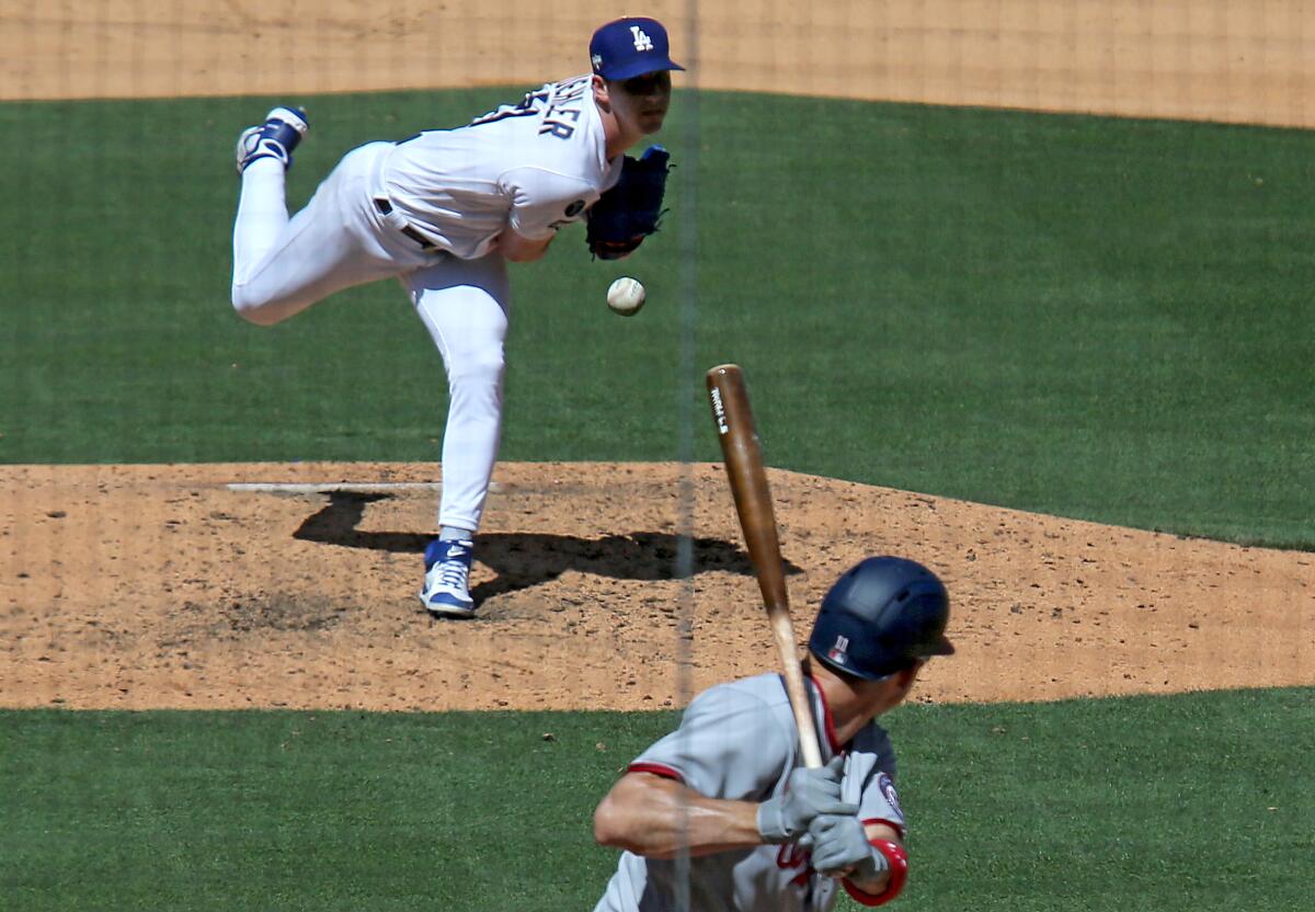 Dodgers starter Walker Buehler delivers a pitch against the Nationals on April 9, 2021.