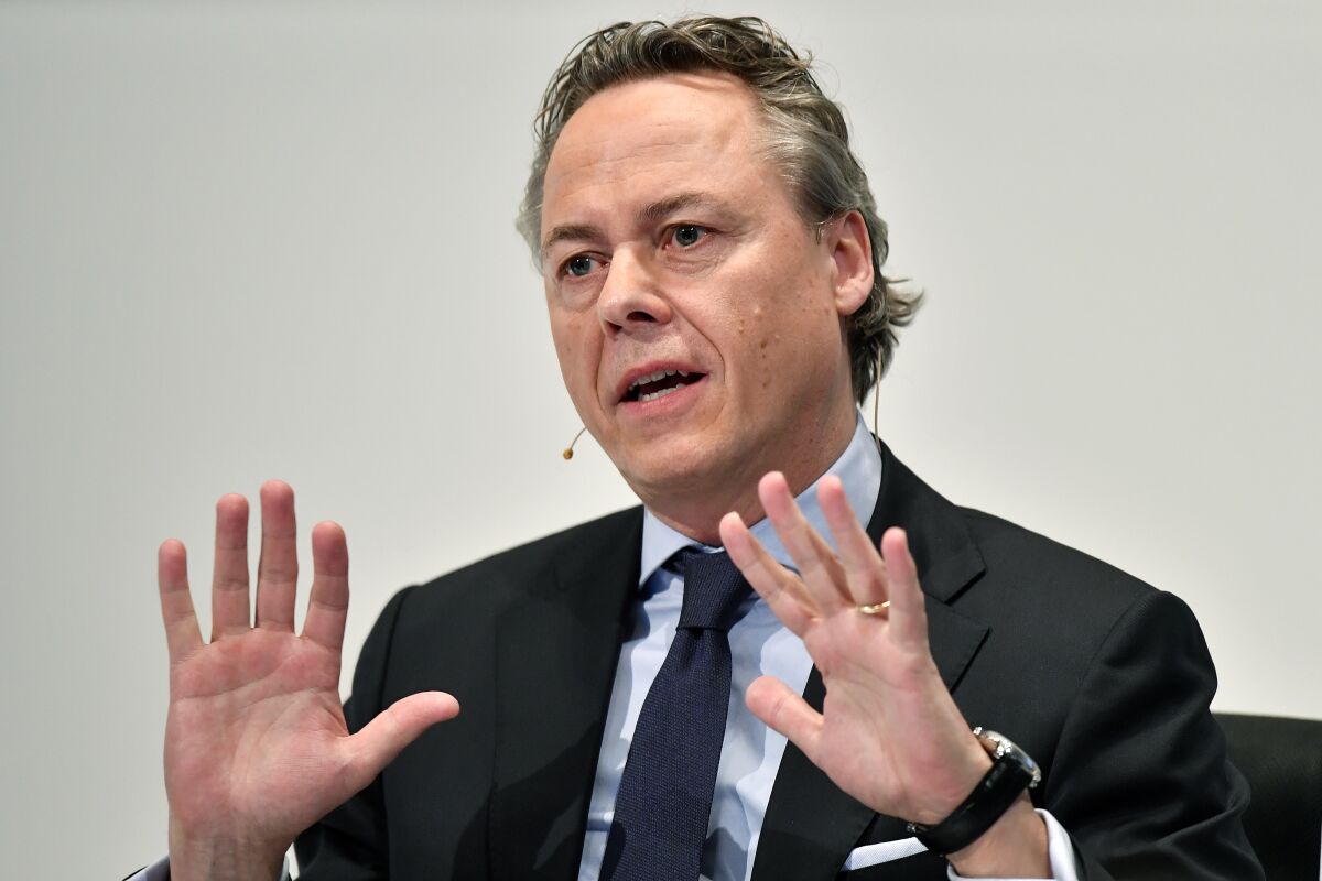 FILE - In this Thursday, Feb. 20, 2020 file photo, Ralph Hamers, new CEO of Swiss Bank UBS, gestures during a press conference in Zurich, Switzerland. A Dutch court ruled Wednesday, Dec. 9, 2020, that Hamers, the former CEO of ING bank, should face a criminal investigation for his role in a money laundering scandal that led to a huge settlement in 2018. (Walter Bieri/Keystone via AP, File)