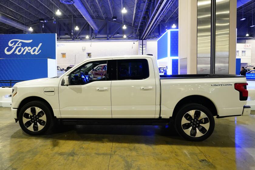 FILE - The Ford F-150 Lightning displayed at the Philadelphia Auto Show, Jan. 27, 2023, in Philadelphia. The Biden administration has proposed new rules that could make it harder for electric vehicles to qualify for a full $7,500 federal tax credit. The rules announced Dec. 1 could complicate efforts to meet President Joe Biden's goal that half of new passenger vehicles sold in the U.S. run on electricity by 2030. (AP Photo/Matt Rourke, File)