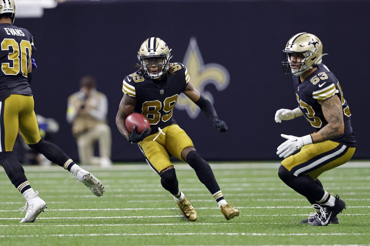 New Orleans Saints wide receiver Rashid Shaheed runs the ball against the Rams.