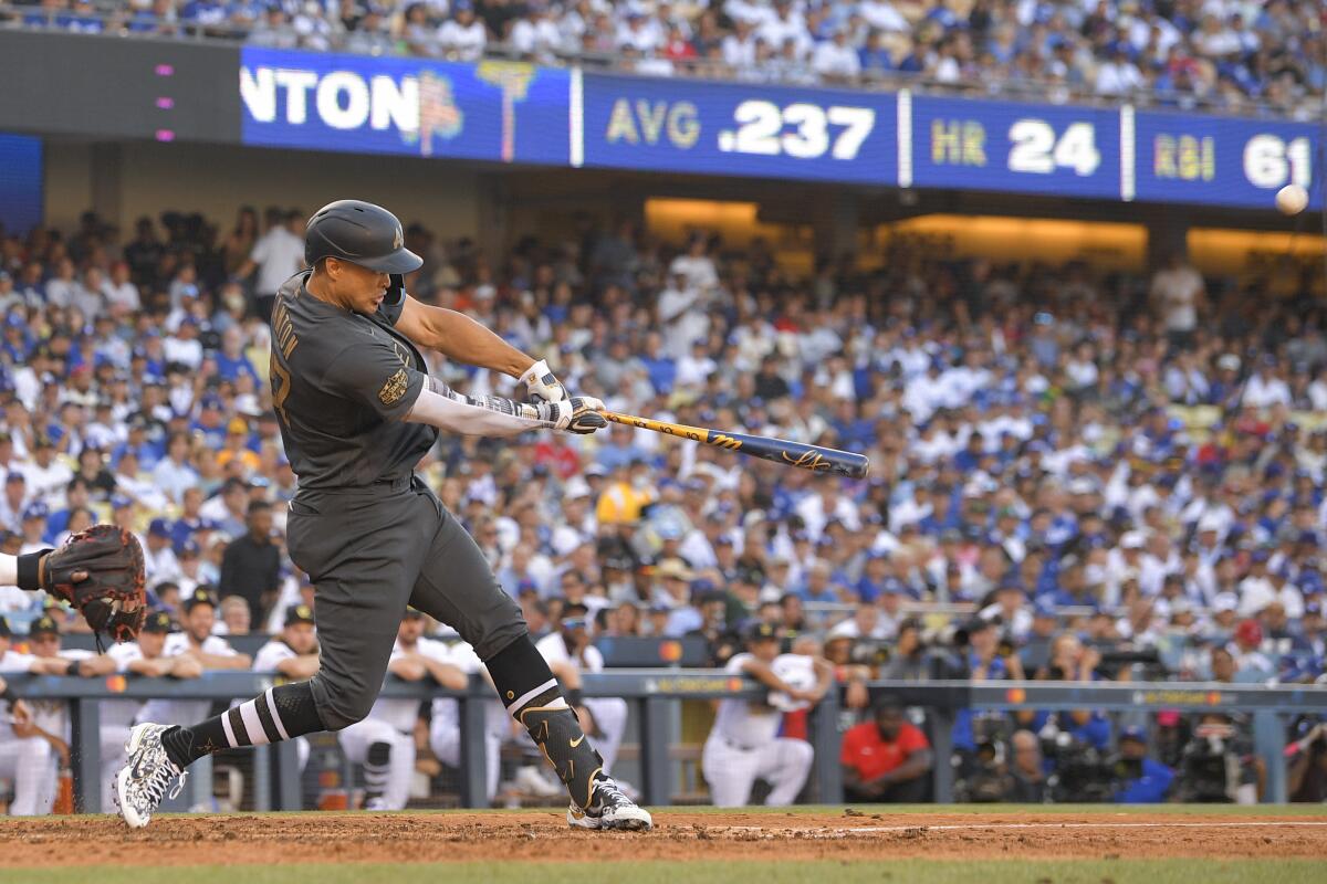American League's Giancarlo Stanton, of the New York Yankees, swings at a pitch while hitting a two-run home run off National League pitcher Tony Gonsolin, of the Los Angeles Dodgers, during the fourth inning of the MLB All-Star baseball game, Tuesday, July 19, 2022, in Los Angeles. (AP Photo/Mark J. Terrill)