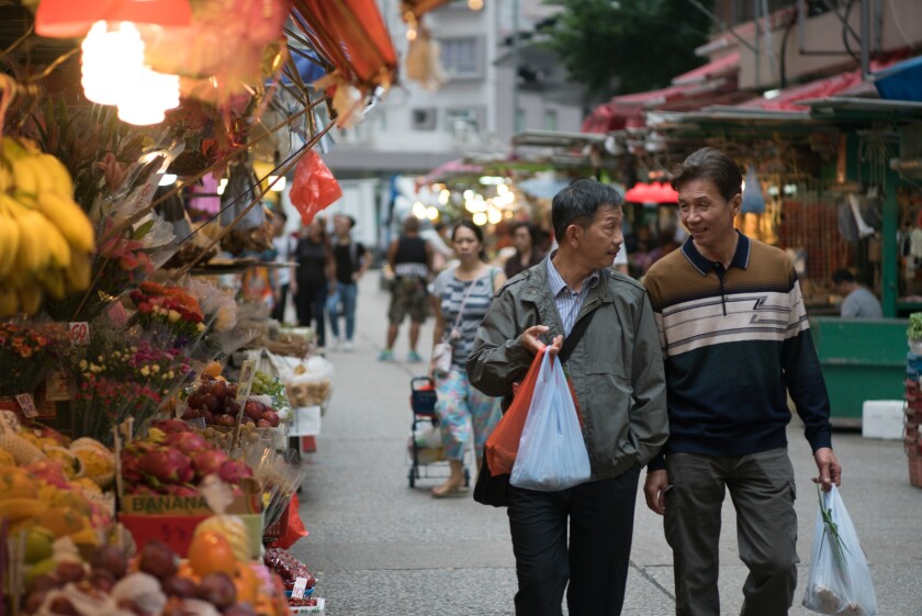 Tai-Bo, left, and Ben Yuen in a scene from the movie "Twilight's Kiss."