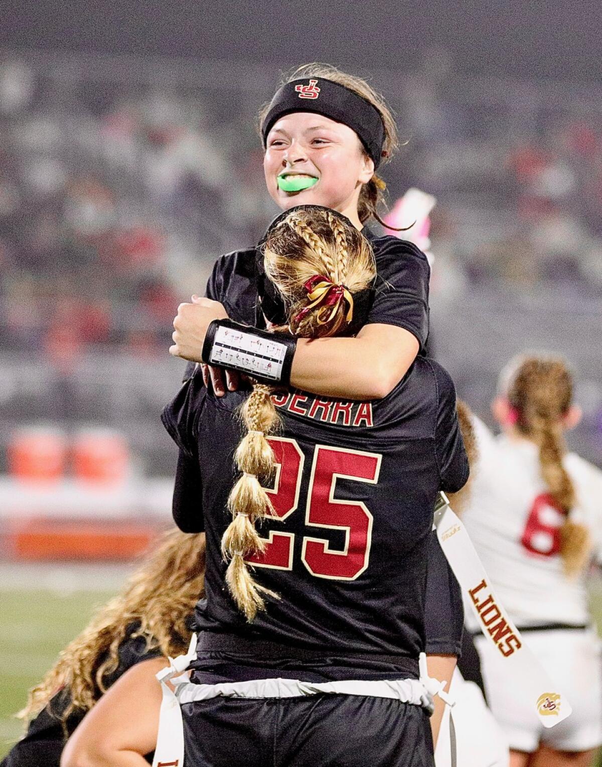 JSerra completes sweep of rival Orange Lutheran to win Division 1 flag soccer title 2 JSerra quarterback Kate Meier leaps into the arms of teammate Kai Beary after running for the winning touchdown Saturday.