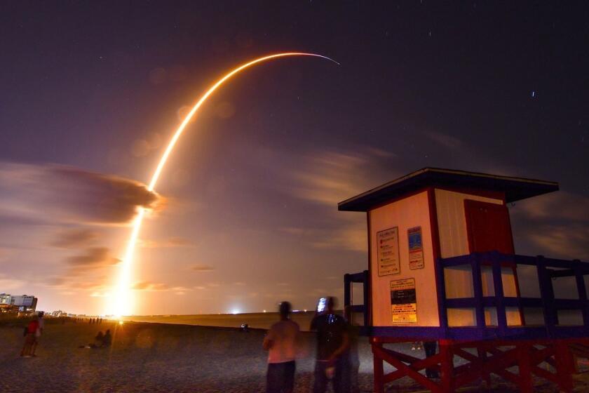 A Falcon 9 SpaceX rocket with a payload of 60 satellites for SpaceX's Starlink broadband network, lifts off from Space Launch Complex 40 at Florida's Cape Canaveral Air Force Station, Thursday, May 23, 2019. A 149 second time exposure of the launch Thursday night is viewed from the end of Minutemen Causeway in Cocoa Beach, Fla. (Malcolm Denemark/Florida Today via AP)