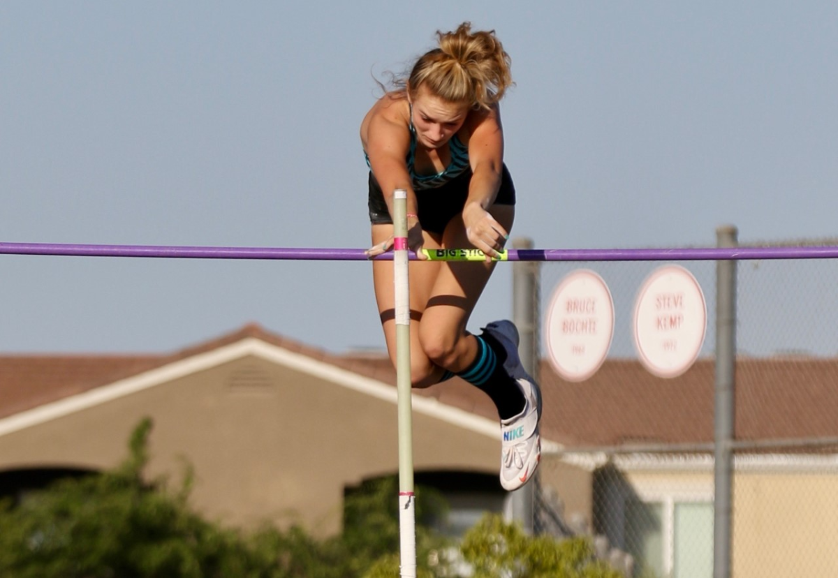 Paige Sommer clears 13 feet 8 inches to win the girls' pole vault competition.